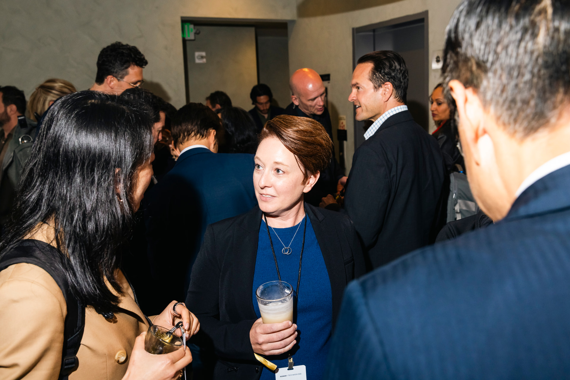 Investors and founders in conversation at a Human+Tech Week 2026 reception.