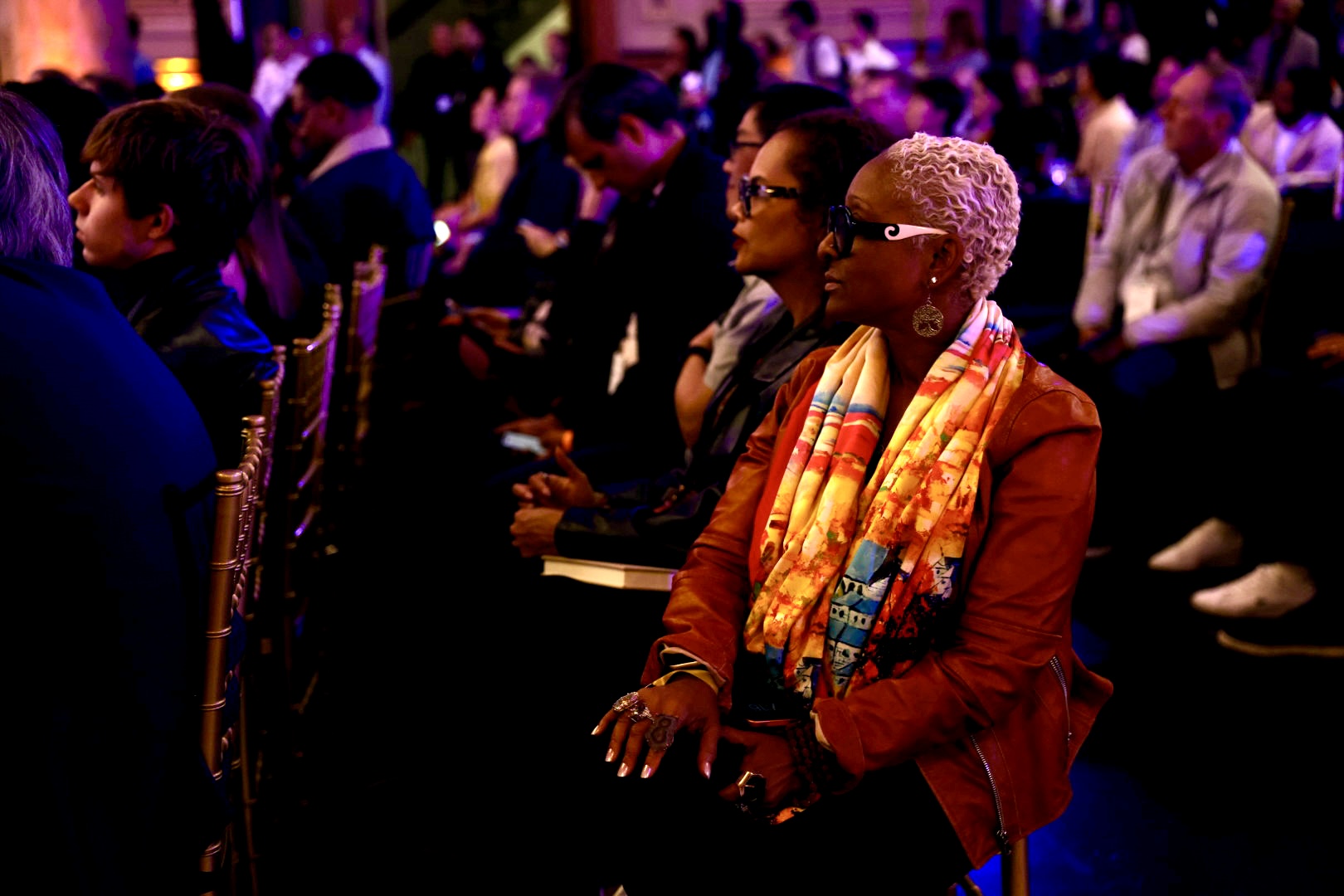 Attendees seated in a row watching a session at Human+Tech Week